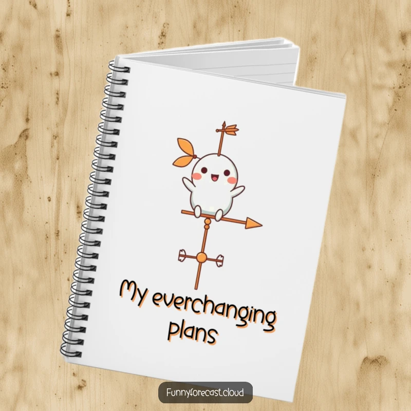 Funny weather vane character cheerfully spinning in a gentle breeze on a notebook, for jotting down ideas.
