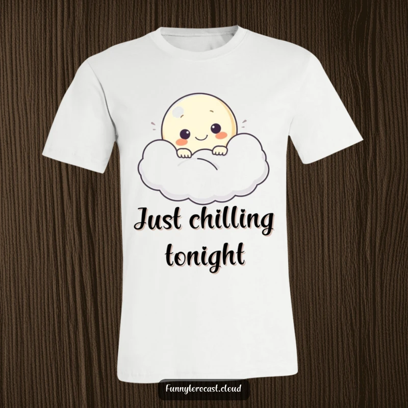 Funny t-shirt showing a happy moon character peeking from behind a cloud, radiating gentle joy and peace.