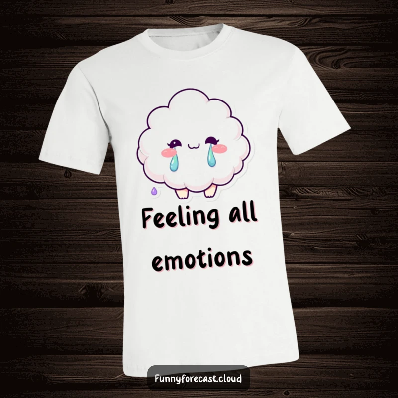 Funny t-shirt featuring a smiling fluffy cloud character crying colorful rainbow tears, expressing joy in sadness.